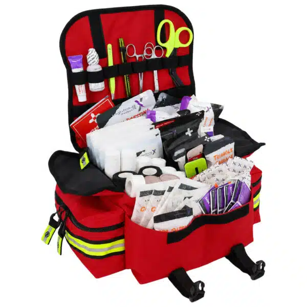 Open red EMS trauma bag showing a complete stocked kit of bandages and supplies