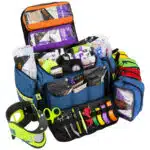 Open blue trauma kit with 6 accessory pouches stocked with professional emt supplies