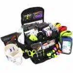 Open black trauma kit with 6 accessory pouches stocked with professional emt supplies
