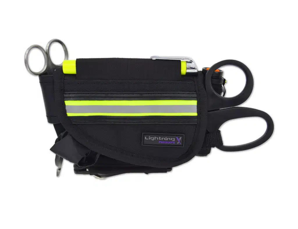 Black EMS holster pouch with fluorescent yellow reflective stripe holding trauma shears