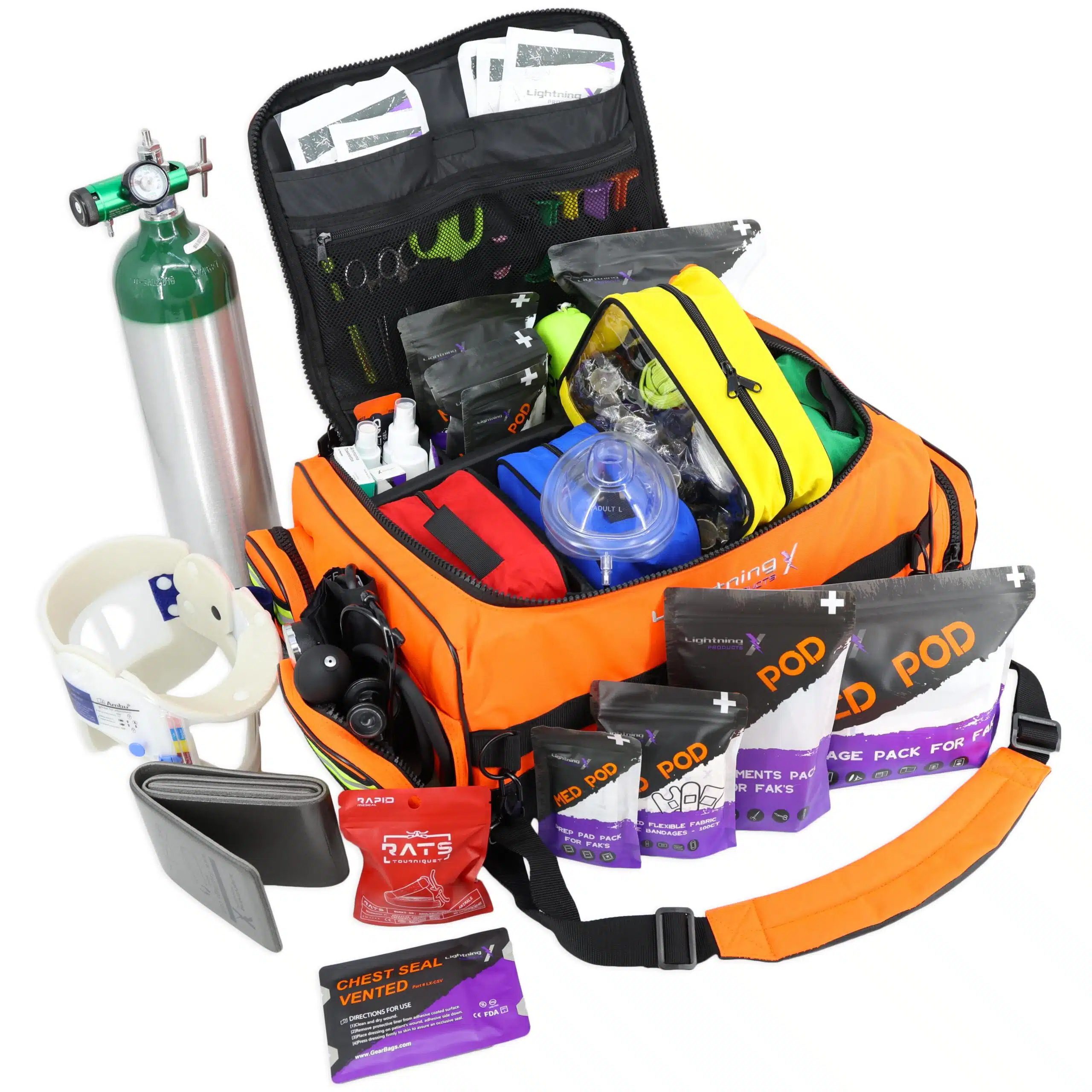 Angled view of fluorescent orange medical bag stocked with and surrounded by medical supplies