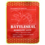 Red and yellow vacuum sealed package of BattleSeal hemostatic gauze