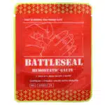 Red and yellow vacuum sealed package of BattleSeal hemostatic gauze