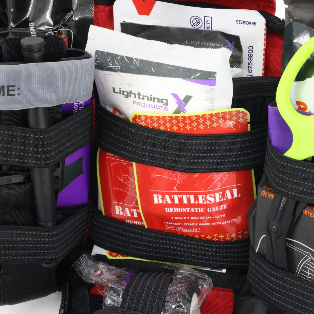 hemostatic gauze pictured with other supplies in first aid kit