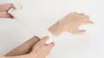 Krinkle gauze being wrapped around a man's forearm