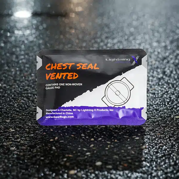 Close-up of vented chest seal on wet pavement