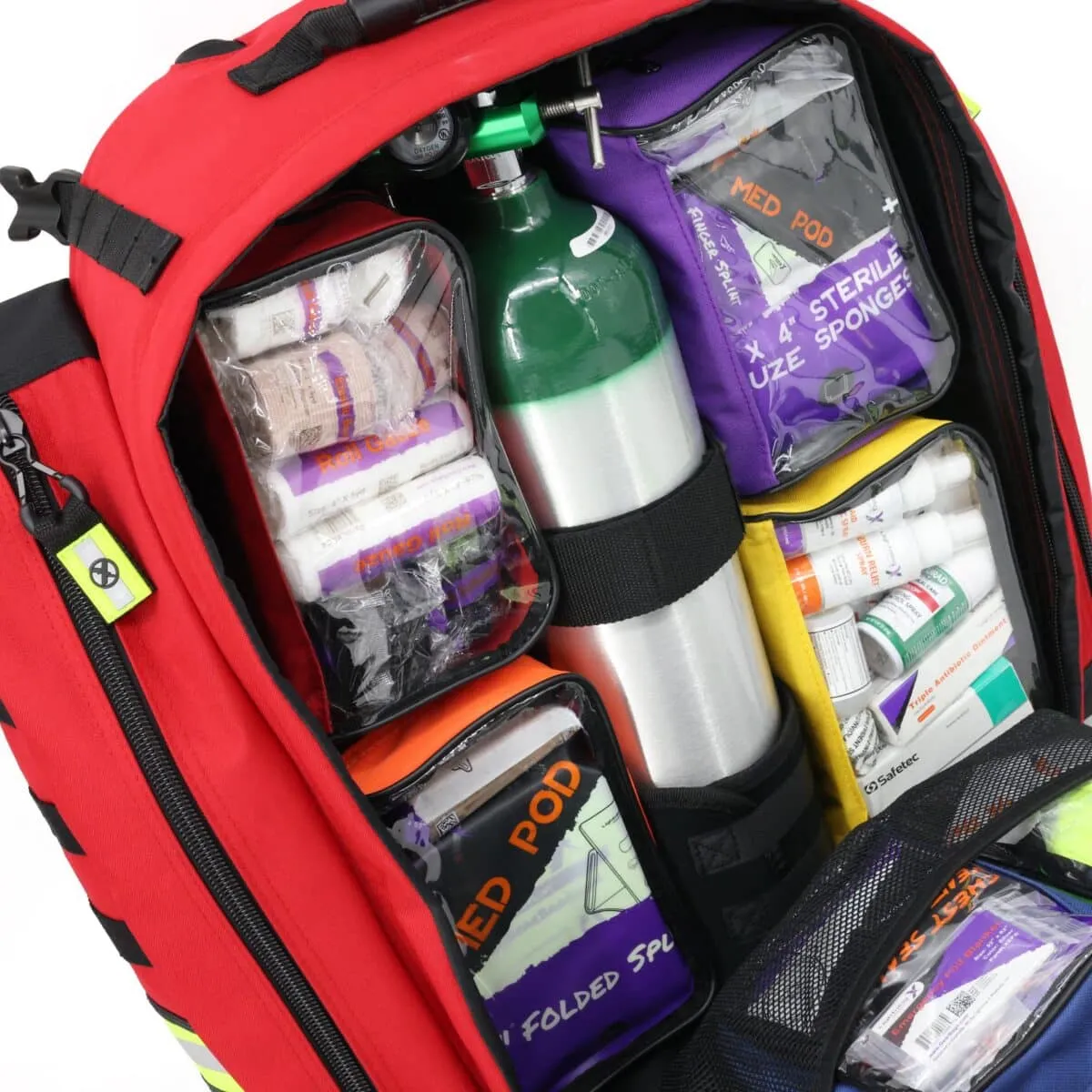 oxygen tank and colored pouches arranged inside red trauma backpack