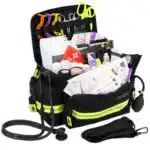 Black EMT bag with reflective trim, filled with first aid supplies