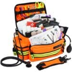 Orange EMT bag with reflective trim, filled with first aid supplies
