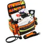 orange emt trauma kit filled with medical supplies, stethoscope and blood pressure monitor
