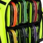 Fluorescent yellow backpack lined with clear vinyl pouches with color-coded orange, green, red, and purple zippers