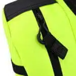 Fluorescent yellow panel with a black molded zipper pull and webbing tab against black trim