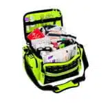 Open hi-vis yellow EMS trauma bag showing a complete stocked kit of bandages and supplies