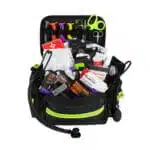 Black stocked first responder bag, open three-quarter view showing a fully stocked EMS kit