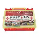 Red hi-vis hard-case first aid kit, closed, with a printed Complete First Aid label and OSHA ANSI Class A markings