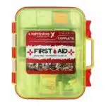 Red hi-vis hard-case first aid kit, closed, with a printed Complete First Aid label and OSHA ANSI Class B markings