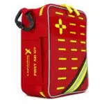 Red soft-shell first aid kit, closed at an angle with a hi-vis yellow cross, MOLLE webbing and reflective stripe