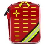 Red soft-shell first aid kit, near front-on with a bold hi-vis yellow cross, MOLLE slots and reflective stripe