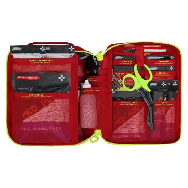 Red soft-shell first aid kit, open interior of color-coded pouches and supplies in labeled mesh pockets