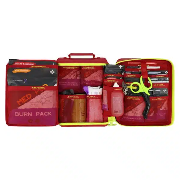 Red waterproof first aid case laid open, showing color-coded trauma and burn supplies in labeled mesh pockets