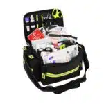 Black mid-sized EMT bag open, three-quarter view showing packed trauma supplies and reflective trim.