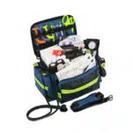 Navy blue mid-sized EMT trauma bag open and fully stocked, angled view with stethoscope and organized supplies.